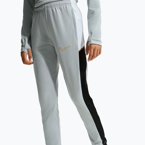 Gyerek nadrág Nike Academy Dri-Fit Jr light smoke grey/white/black/metallic gold