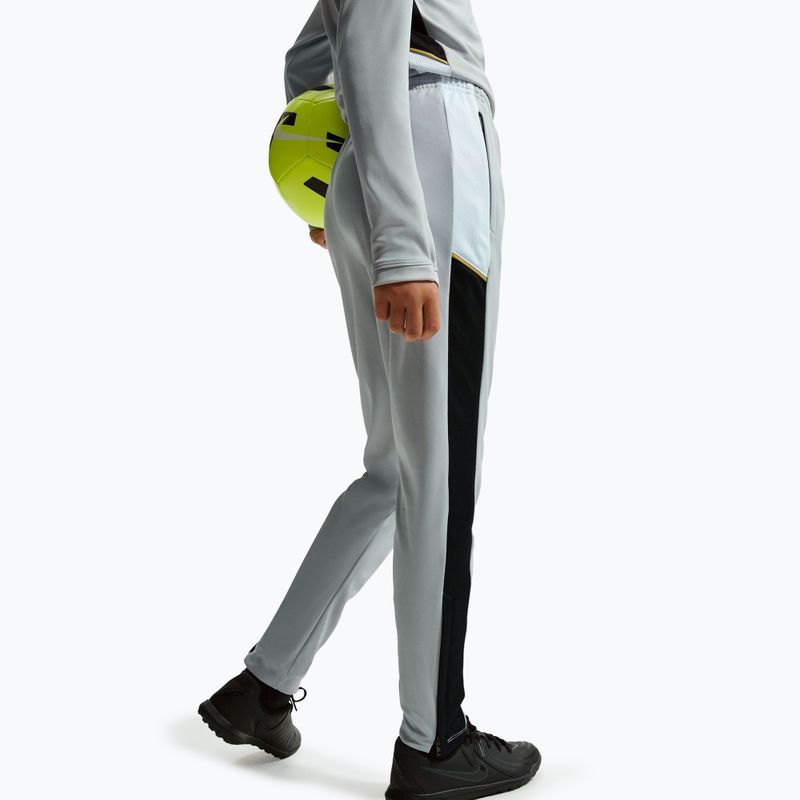 Gyerek nadrág Nike Academy Dri-Fit Jr light smoke grey/white/black/metallic gold 6