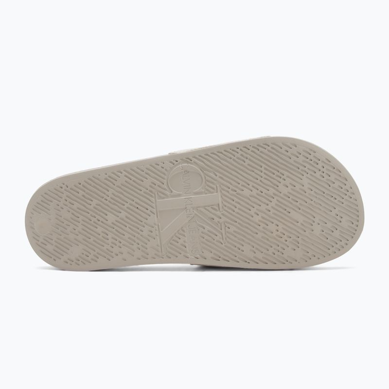 Férfi Calvin Klein YM0YM01269 Slide Aop Print tojáshéj/teknőc galamb flip-flopok 4