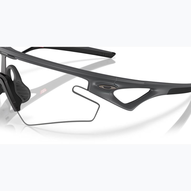 Napszemüveg Oakley Sphaera Slash carbon/clear to black iridium photochromic 6