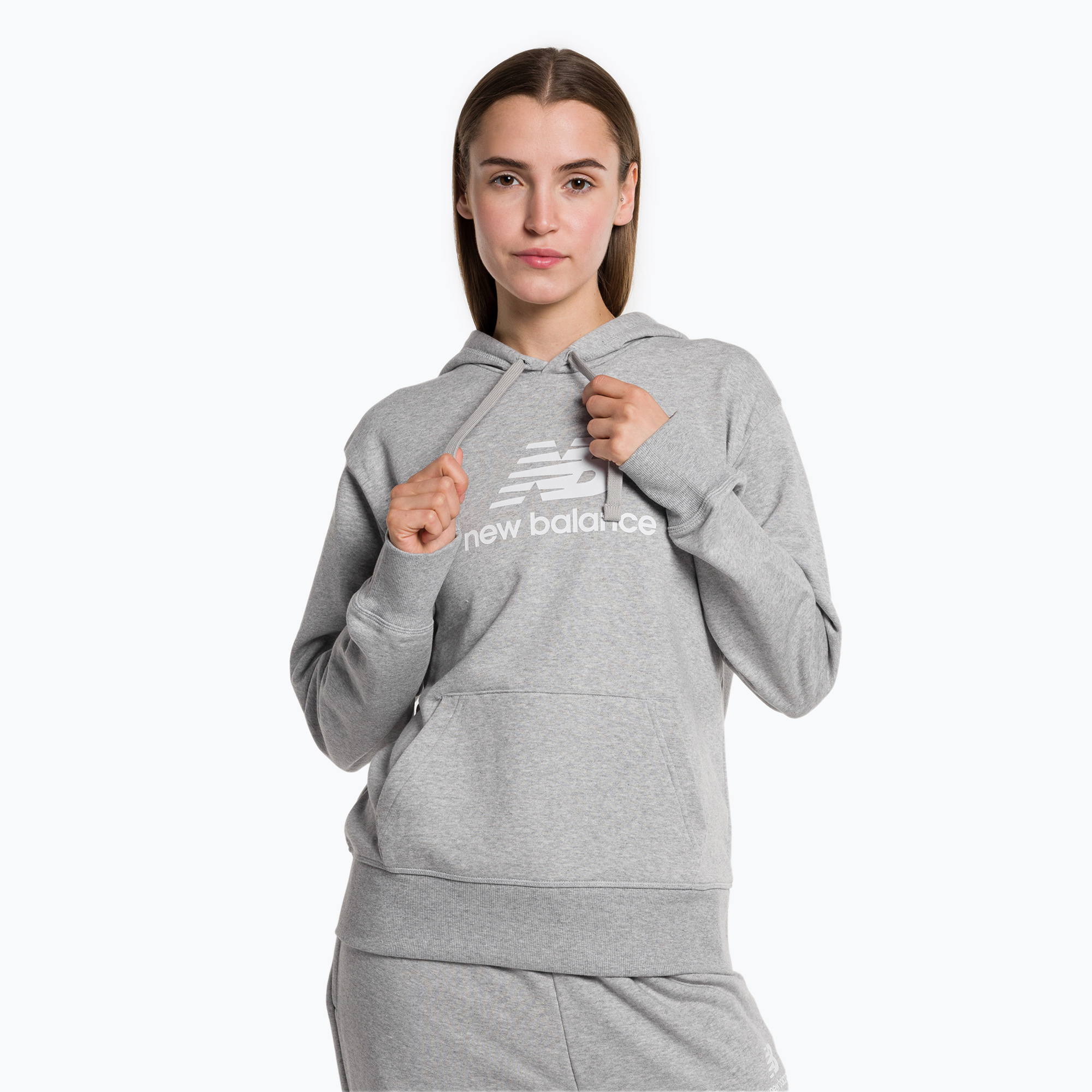 36%-kal olcsóbban.  Női tréning pulóver New Balance Essentials Stacked Logo French Terry kapucnis pulóver szürke NBWT31533. Méret: M